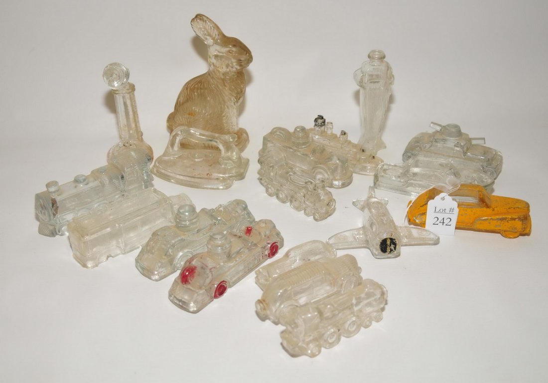 Vintage glass candy containers: airplane, bunny, cars, telephone, boat, total of 18