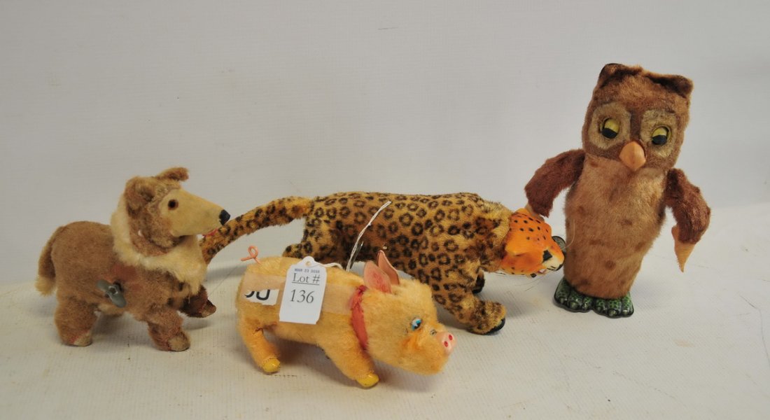 Collection of wind up toys: Signed Marx owl chirps, eyes open and wings flap. Signed Marx leopard walks, growls, and head moves. Pig made in Japan, walks, snout, ears and tail move. Collie dog unsigned, walks and head moves.
