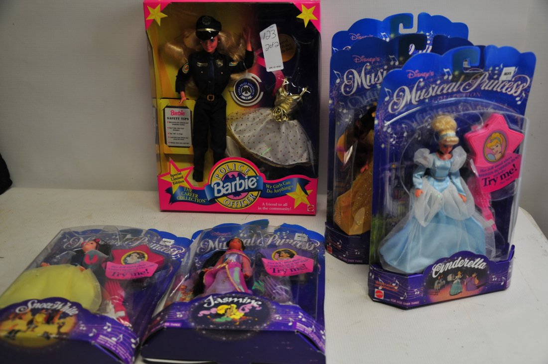 Two Boxes of New Old Stock Barbie Items: Unopened figures and games