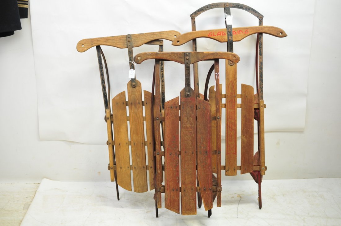 Three runner sleds to include: Perfection made by American Toy & Novelty Works, York PA, 29 x 19. Gladding 40 x 22 and old wooden sled 26 x 23.