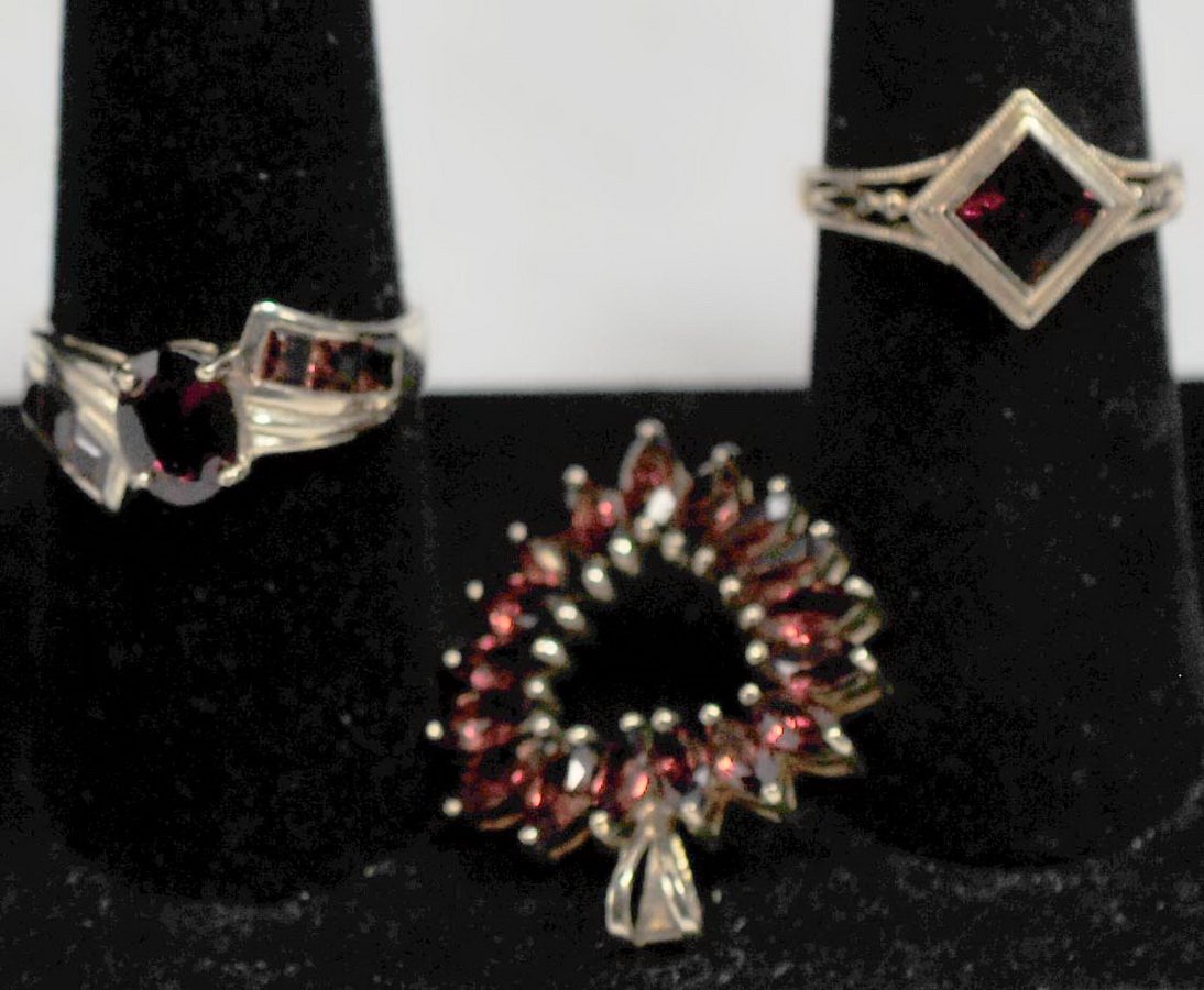 Three 10Kt Garnet Pieces: Two rings size 7 and 9 and Garnet Pendant Heart Shaped, total weight is 7.93 Grams