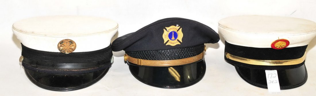 Estate Collection of 7 Hats: Military, Fire and Police, with some hat badges including Halifax Fire and Unknown police