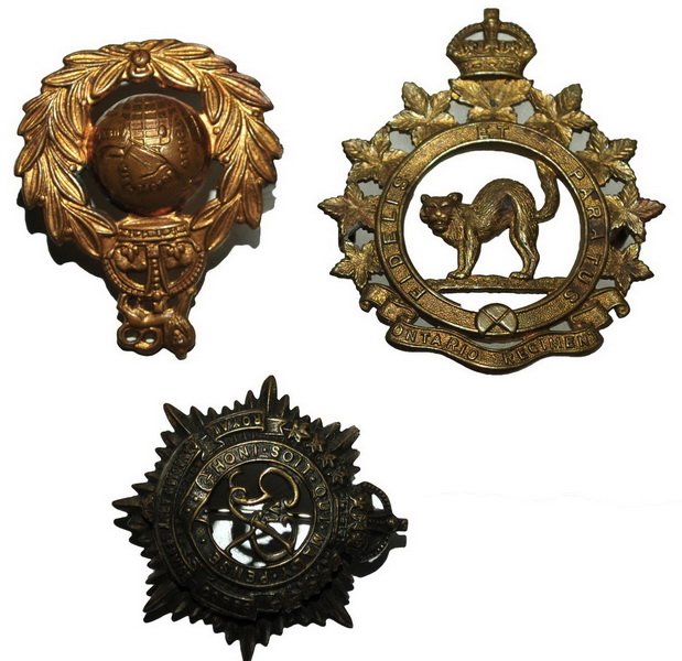Three WWI and WWII Canadian Hat Badges: All in plastic cases including Ontario Regiment, and service corps