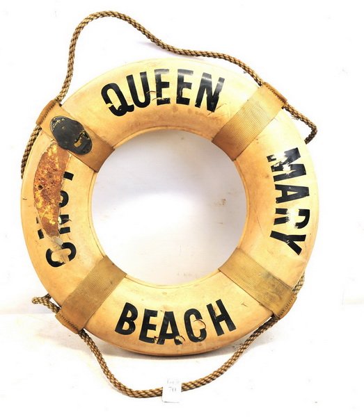 Original Queen Mary Long Beach Life Preserver: Marked on one side "Queen Mary Long Beach" and hand written "Chief Indian Giver" on rear, has rope affixed 22" Diameter. Also attached is a worn out US Coast Guard Metal Tag