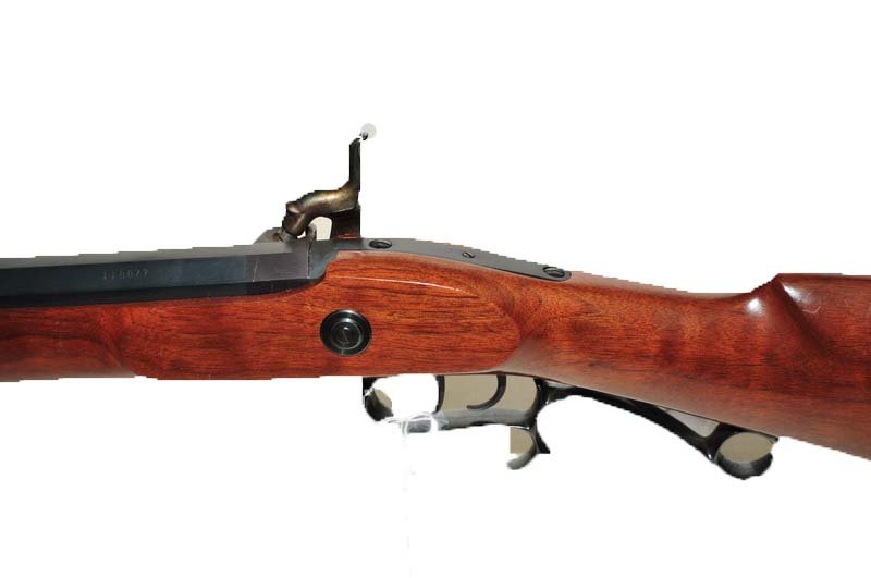 Thompson Center 50 Caliber Black Powder Rifle: Wood Stock, 99% case colors in excellent condition