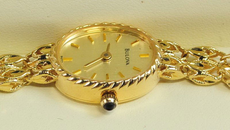 Ladies Bulova 14K Gold Watch: Ladies Bulova 14K Gold Watch running and excellent condition with new battery. Total weight 15.3 Grams,