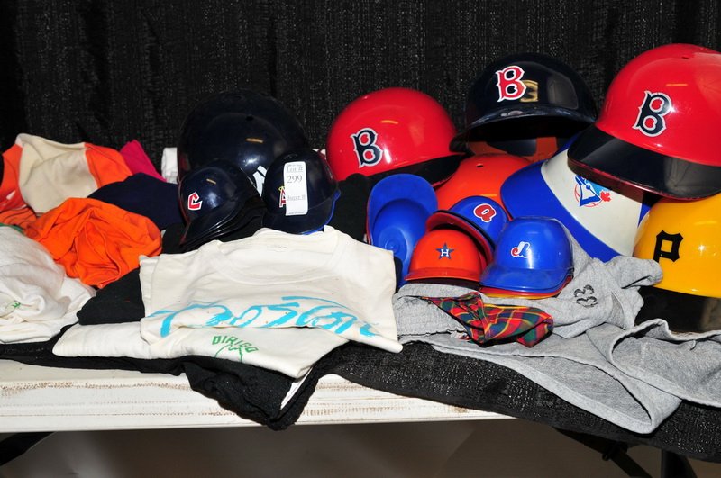 US Army summer officer's uniform and a: Collection of young Men's tee shirts and shorts of many sizes along with a large box of baseball hats.