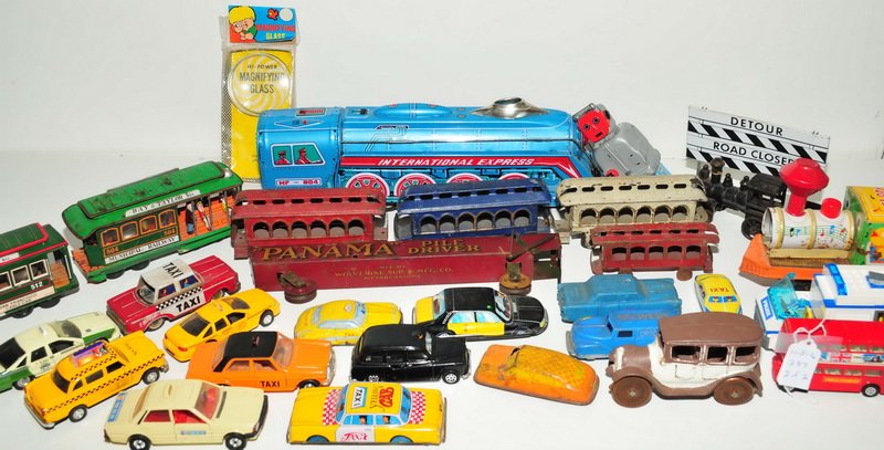 Over 30 antique and old: cars, trucks, trains to include: Cast iron 568 train, Municipal Railway 504 for Powell & Mason Streets and etc.
