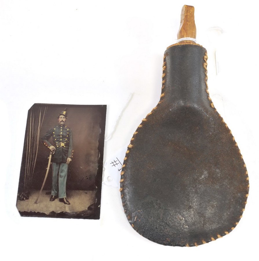 Civil War Tin Type and Powder Flask: Unknown soldier 3 1/2"x3 colored tin type and 7" powder flask, leather construction with wood cork, from the descendants of William F. Quint