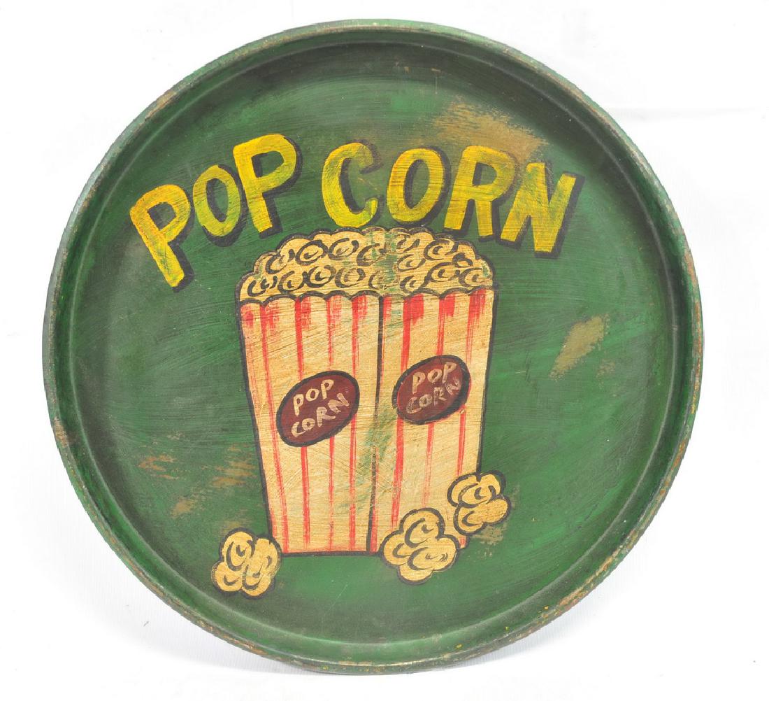 Large round metal serving tray 21.5" wide: Nice large round metal serving tray with nice green paint and painted popcorn art in the center. Serving tray is 21.5" wide and 1.5" tall and is well constructed.