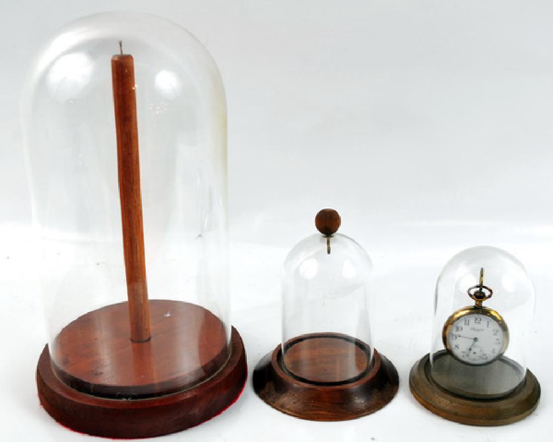 Pocket Watch & 3 Glass Dome Top Display Cases: Standard USA Pocket watch with 3 Glass Dome Top Display Cases with wood base for pocket watches and more. Largest of the 3 is 11" tall and the other 2 are about 5" tall.