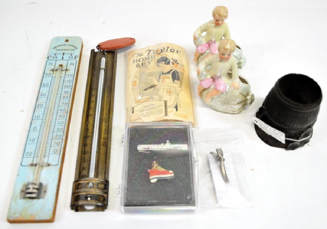 Estate Items Advertising/Collectibles: Gutta Percha Carved Toothpick holder 19th Century, Pair of Porcelain Toothpick holders boy on a pumpkin, Universal Standard Thermometer, The Taylor Homeset Candy Thermometer with booklet, Bath Iron Wo