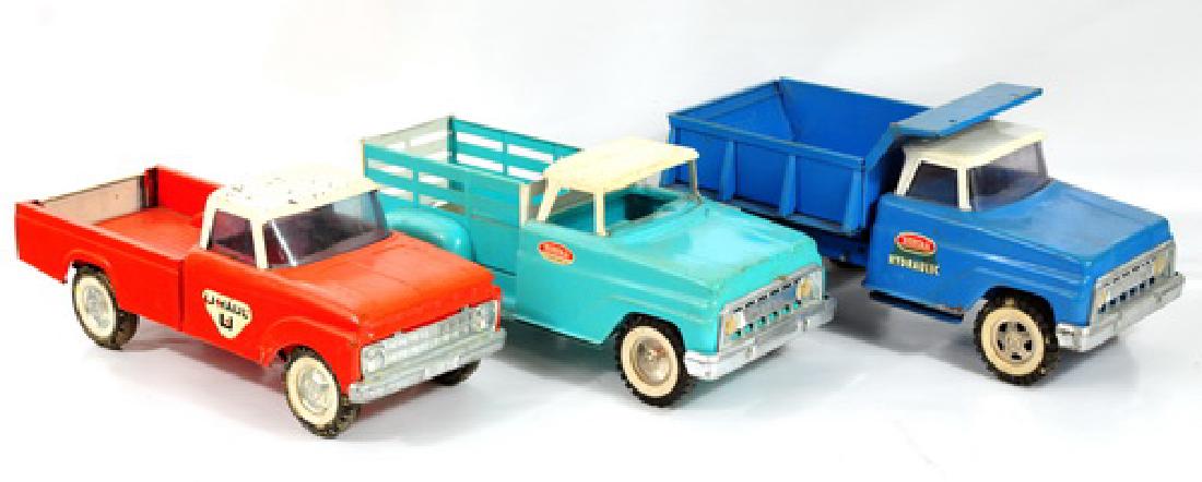Four boxes of toys containing the following: 4 wooden toys by Creative Playthings made in Finland, 16 metal cars and trucks by Matchbox king size, Cragstan, Tonka, Buddy L