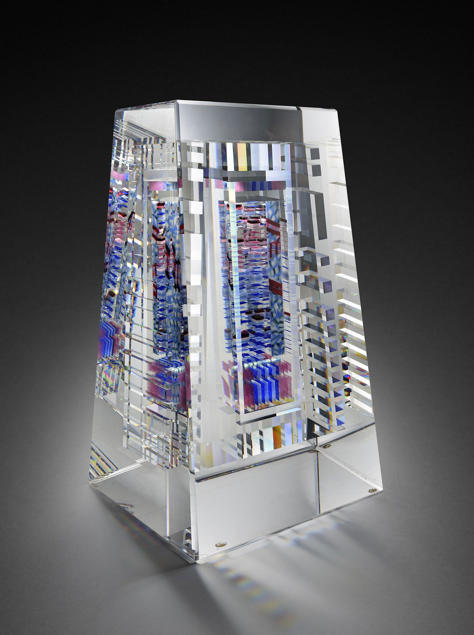 Jon Kuhn Olydian Mix 1990 Art Glass Habatat: Jon Kuhn, (USA), Olydian Mix, 1990, 16 x 9.5 x 8.5 inches. Among cold glass artists, Kuhnâ€™s work stands out for its complexity, its geometric forms and for its presence which has almost a spiri