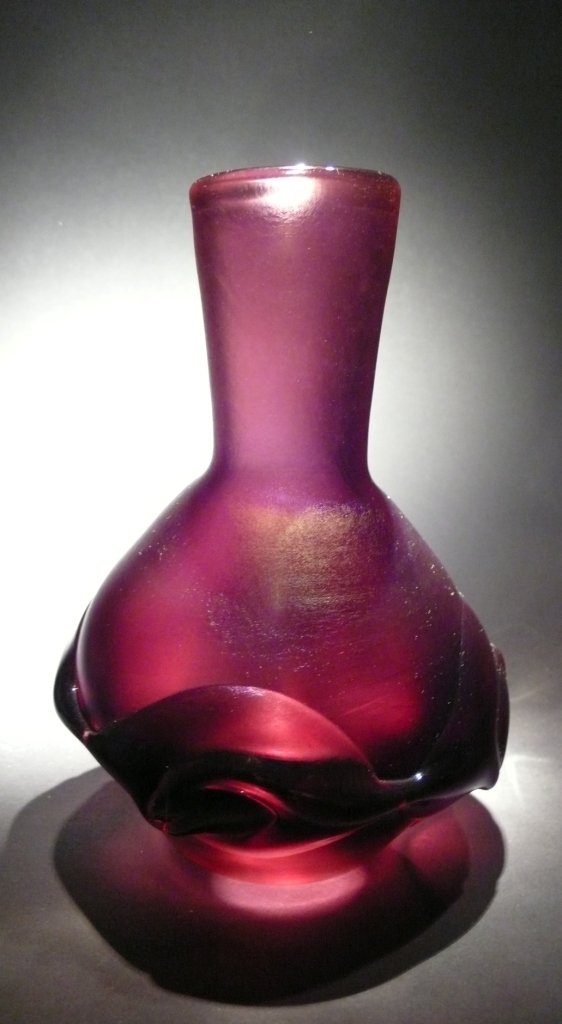 Dominick Labino 'Untitled' metalic burgundy vase: Blown glass metalic burgundy vase with glass embellishment 7 ½ '' x 5 ¾ '' x 5 ¾ '' 1971
