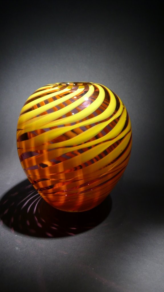 Dominick Labino 'Untitled' translucent red and yell: Blown glass translucent red vase with yellow spiral design 5 ½ '' x 5 ½ '' x 5 ½ '' 1970