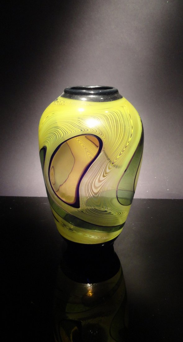 Kurt Wallstab 'Untitled 1984' small vase with abstr: Blown glass vase with abstract green swirls and orange oval shapes navy blue bottom and rim (M059) 5'' x 3'' x 3''