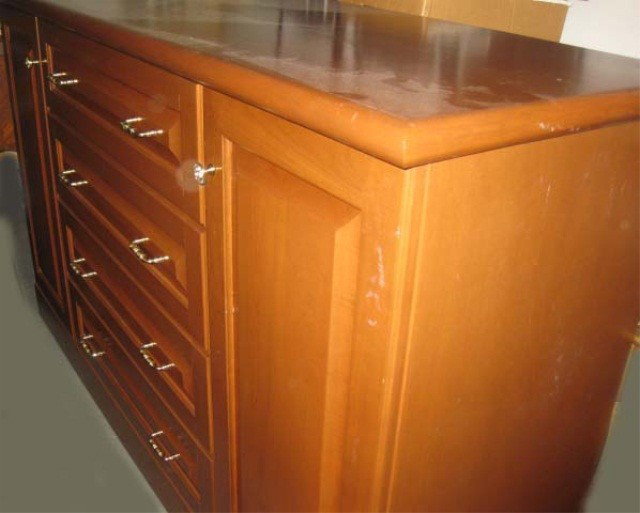 Mahogany Credenza: 4 center drawers flanked by doors, 38 inches tall, 62 inches wide, 20 inches deep