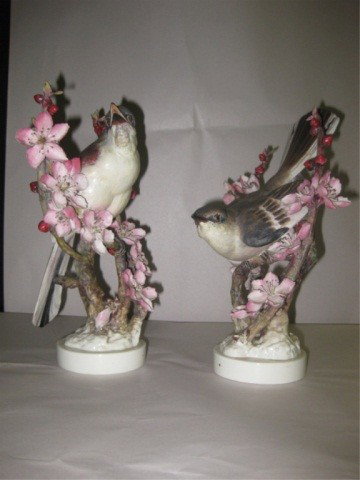 Pair of Dorothy Doughty Mockingbirds: Royal Worcester, (one having broken and re-glued branch), 11 inches tall