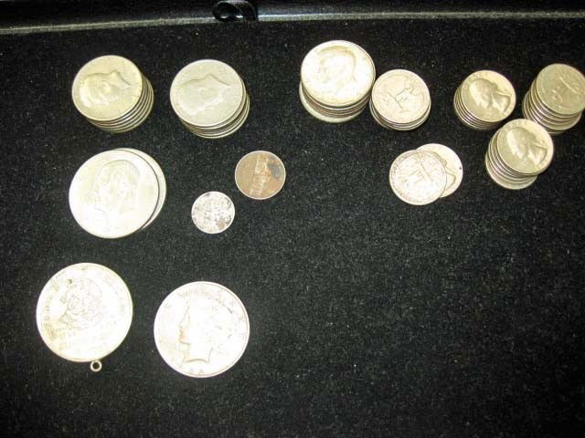 Assorted Coins: $20.40, including 1922 Peace, 2 Eisenhower dollars, 19 JFK half dollars, 31 quarters, 1 nickel, 1 dime, and 1952 Mexican 5 Pesos (.720) silver coin