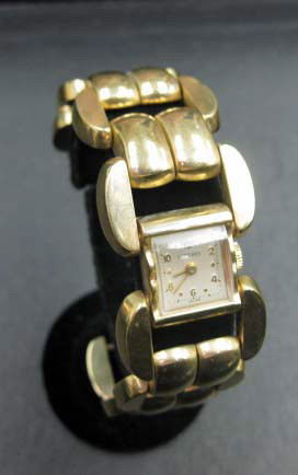 Longines 14K Gold Ladies Watch: 29 dwts. including the weight of the timepiece. 7 inches