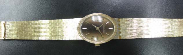 Men's 14K Gold Lucien Piccard Watch: on 14K gold band, 39.05 dwts. including the weight of the timepiece