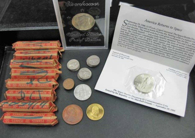 Collection of Coins: uncirculated Eisenhower proof dollar, Marshall Islands Discovery Commemorative $5 coin, 8 rolls of pennies, JFK half dollar, 14 nickels, 4 Canadian pennies, Nixon token, and Washington token