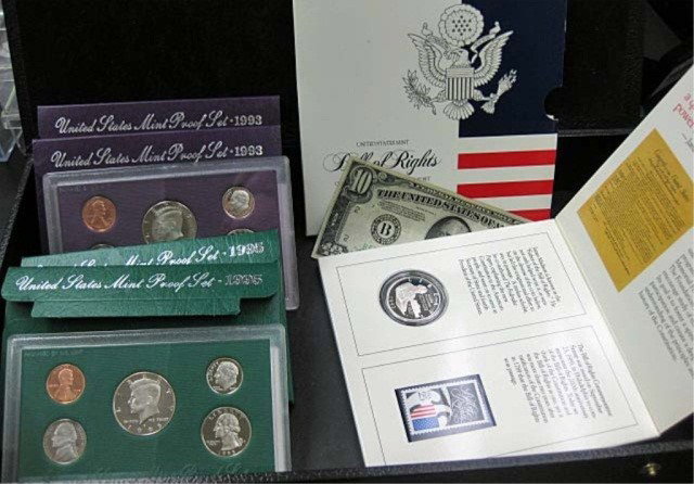 4 Proof Sets, Commemorative Coin and $10: $10 bill, 2 1993 proof sets, 2 1995 proof sets, and Constitution commemorative coin and stamp set
