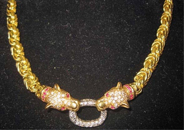 18K Gold Necklace with Diamond Accents: 16 inch choker with leopard form heads, set with red stone eyes and collars, 35 dwts.