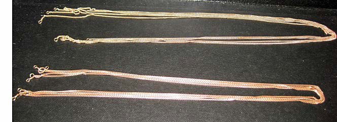 8 14K Gold Necklaces: 9 1/2 - 21 3/4 inches, no clasps, 4 rose gold box chains and 4 yellow gold chains, 19 dwts.