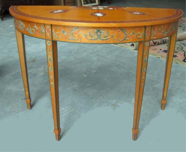 Pair of Chelsea House Demi Lune Consoles: In the Sheraton manner, with Angelica Kaufmann style painted motif, having brass Chelsea House Label, 32 inches high, 45 inches across the widest point, 19 inches at the deepest point