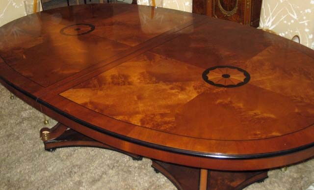 Regency Style Walnut Dining Table: double pedestal tripod base, 29 inches tall, 79 1/2 inches wide, 46 1/2 inches deep, with 2 leaves