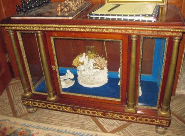 Louis XVI Style Table Top Curio Cabinet: mahogany, having bronze mounts, 4 bronze columnar support front, 1 door, all over floral and angel motif valences, 26 1/2 inches tall, 37 3/4 inches wide, 16 inches deep