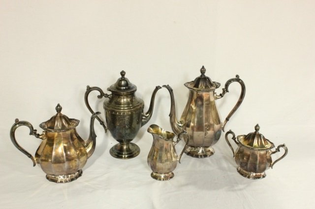 Group of 6 Silver Plated Articles: Six vintage silver plate coffee and tea pots along with a creamer and sugar bowl. Great for your dining room. Silver plate serving pieces to accompany your dinner service or dessert service.