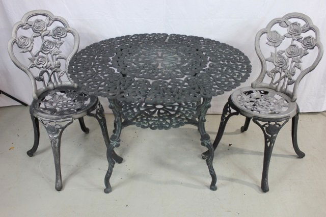 Metal Patio Table and Two Chairs: Table height 27 Inches, Diameter 38 Inches; Chairs Height 35 Inches, Seat Diameter 15 Inches