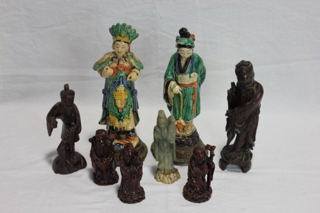 Group of Eight Chinese Statues & Scholars: Two Porcelain. Five Wood. 1 Soapstone. Assorted sizes. Hand painted porcelain.