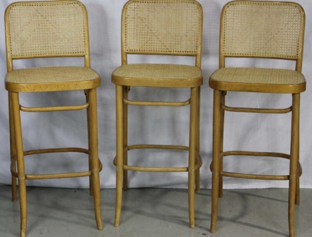 Three Contemporary Modern Caned Bar Stools: Height 44 inches. Width 18 inches. Depth 16 inches.