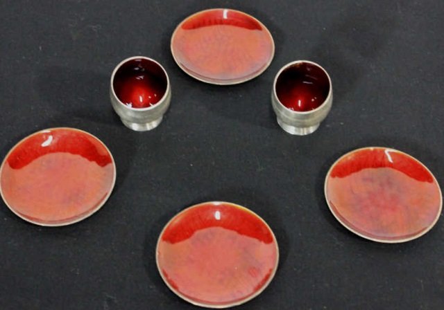 A Michelsen Copenhagen Denmark Sterling Set: Four small dishes and two cups with enamel decoration. Plate Diameter 3 Inches