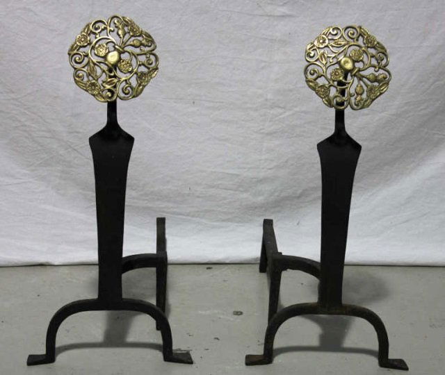 Wrought Iron and Brass Andirons: Height 23 Inches Width 10.5 Inches Depth 18 Inches Brass has Pineapple and Flower Motif