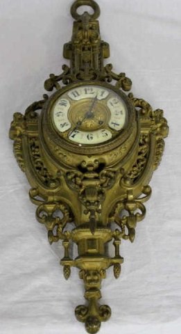 French Rococo Style Ormolu Bronze Cartel Clock: Measures 30 by 12 inches.
