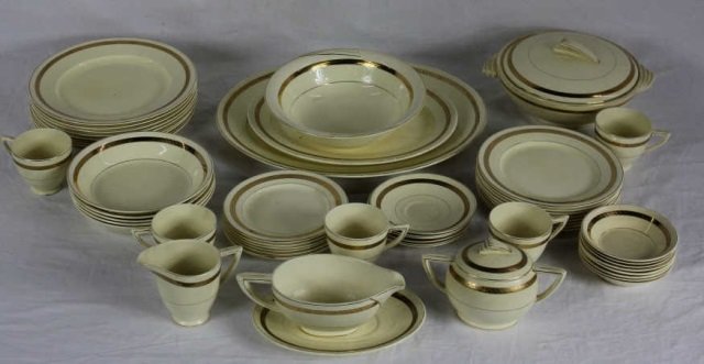 Art Deco Style Wedgwood Dinner Service: 8 Dinner plates. 8 Salad plates. 7 Cake plates. 5 Soup bowls. 5 Cups. 6 Saucers. 8 Berry bowls. Sugar & Creamer. 2 Platters. Covered Tureen. Sauce boat. Serving bowl. Diameter Dinner Plate 10"