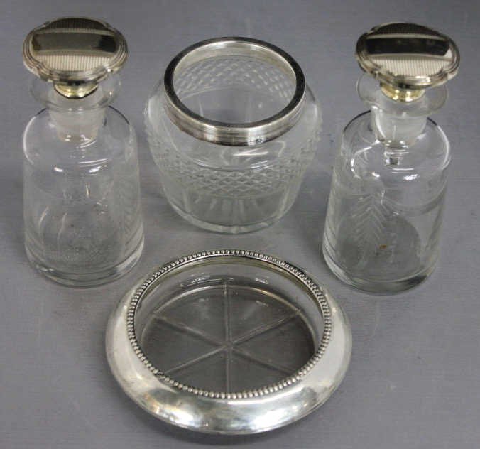 4 Cut Glass & Sterling Silver Articles: Property of a Scarsdale, NY Estate. Pair of perfume bottles marked Sterling. Sterling rimmed jar hallmarked. Sterling rimmed Coaster hallmarked.