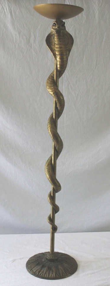Vintage Serpentine Form Torchiere Stand: Property of a Monticello NY Estate. Height 44 inches. Diameter of base 10 inches.