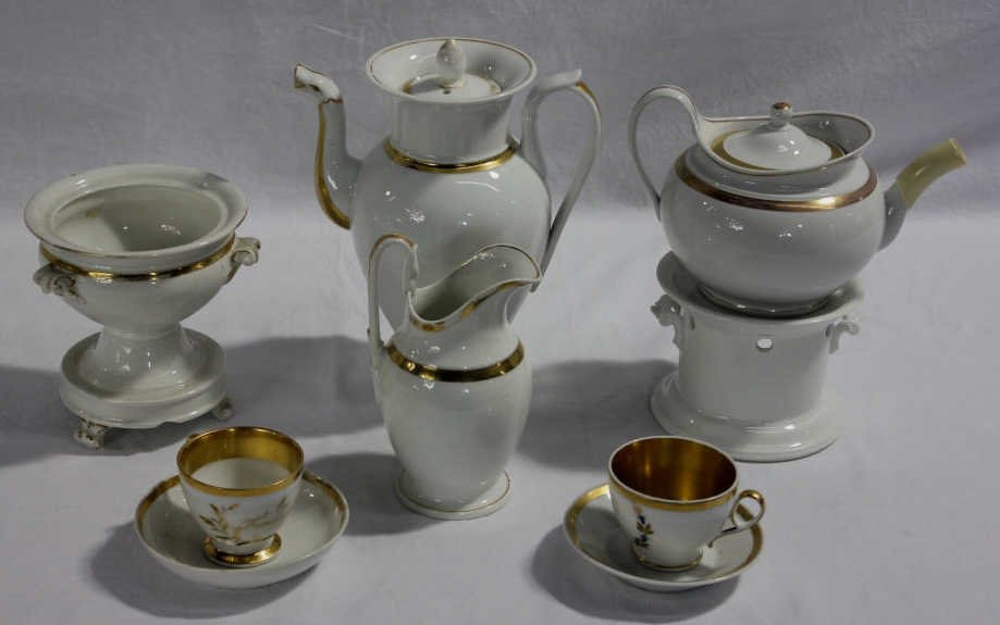 Assorted Old Paris Porcelain Serving Pieces: Coffee pot, teapot, creamer, two stands, two teacups w/ saucers. Height of Coffee Pot 10.5 inches. Estate of Warren Dieter Zander.