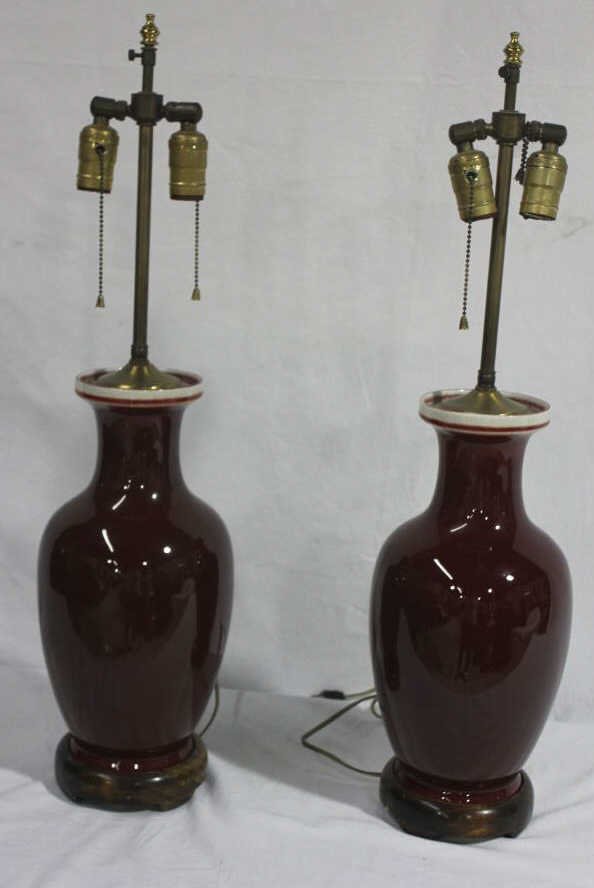 Pair Chinese Porcelain Oxblood Lamps: Height 28 inches. Estate of Warren Dieter Zander.