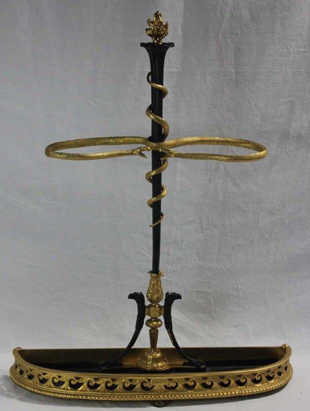 French Empire Style Gilt Bronze Umbrella Stand: Figural Serpent Motif. Height 34 inches. Width 26 inches. Depth 7.5 inches. Estate of Warren Dieter Zander.