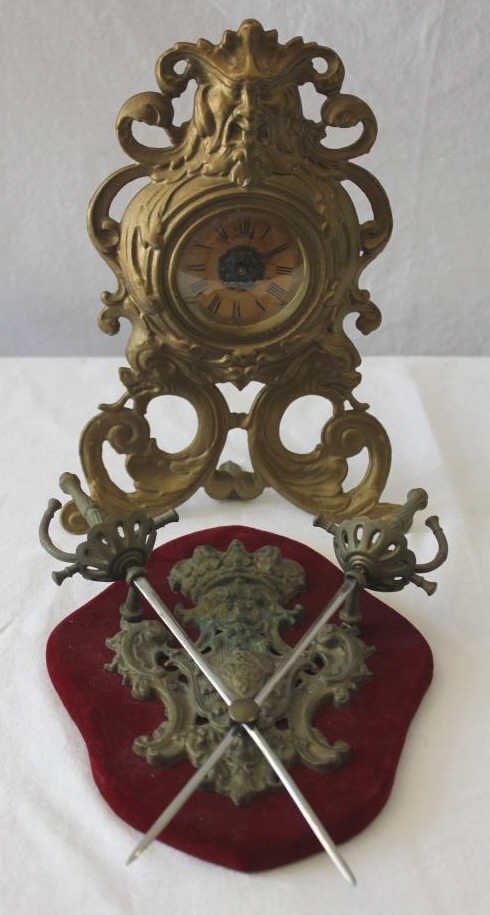 Antique Gilt Metal Mantle Clock w. Coat of Arms: Property of a Monticello NY Estate. Height of Clock 11 inches.