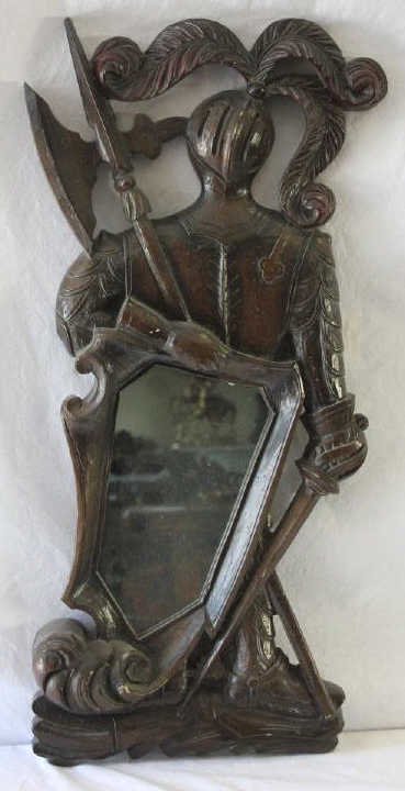 Carved Wood Suit of Armor Mirror: Property of a Monticello NY Estate. Height 32 inches. Width 14 inches.