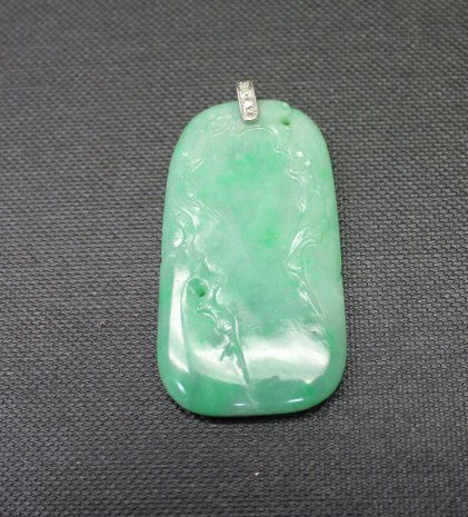 Chinese Carved Jade Diamond & Gold Pendant: Carved jade pendant with white gold bale set with diamonds. All stones test as diamonds. Jade pendant measures 2 inches (plus diamond clasp) by 1 inch.