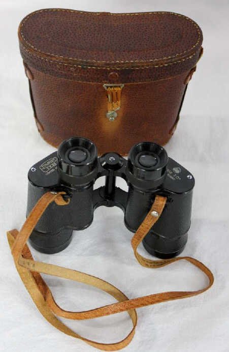 Vintage Pair of Binoculars: Property of a Manhattan Estate. In original case. Case measures 6 by 8 inches.